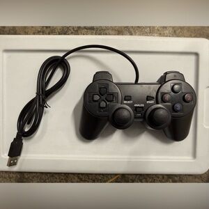 Wired Black Video Game Controller with Dual Analog Sticks not tested